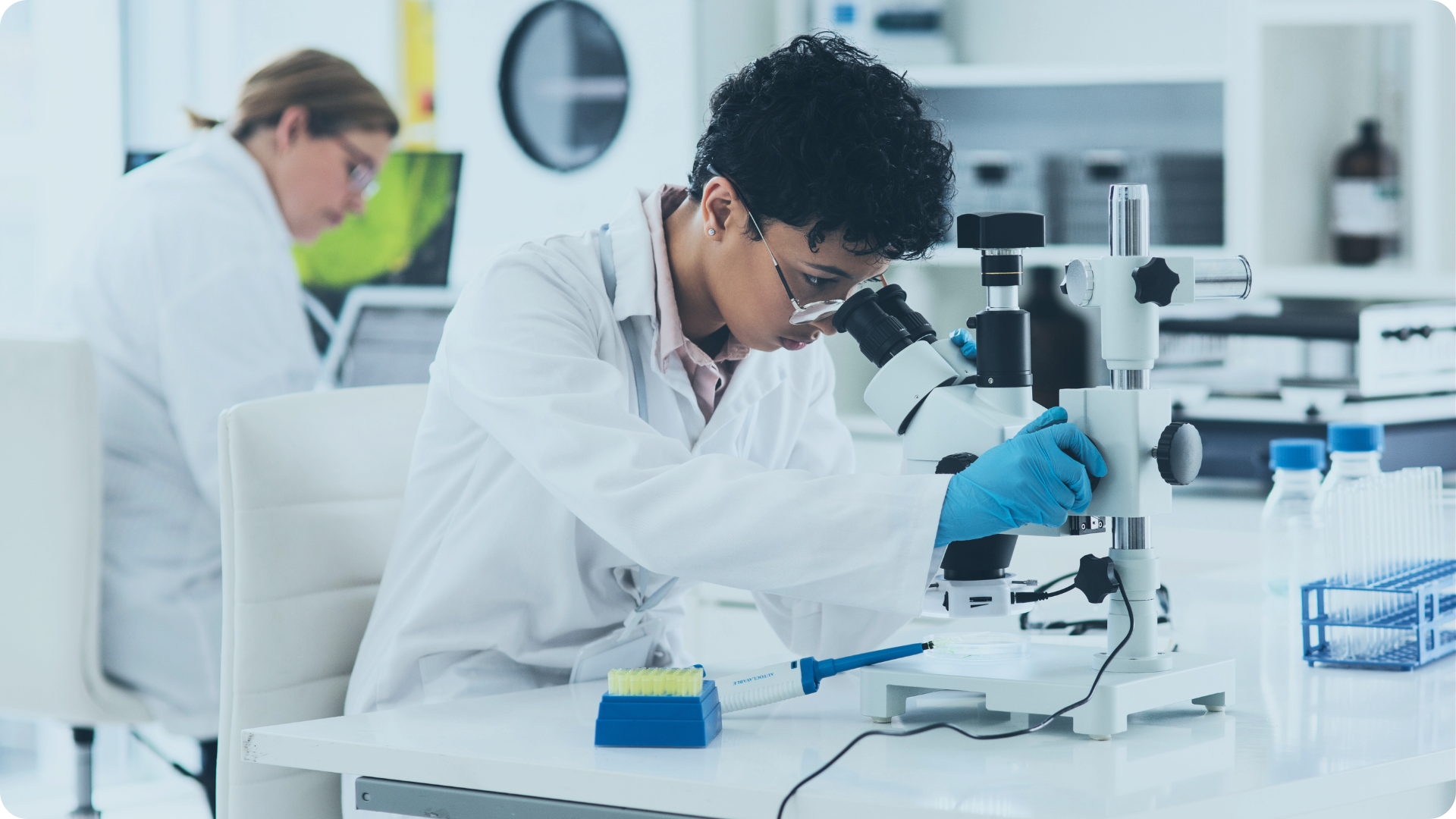 Clinical lab tech at microscope